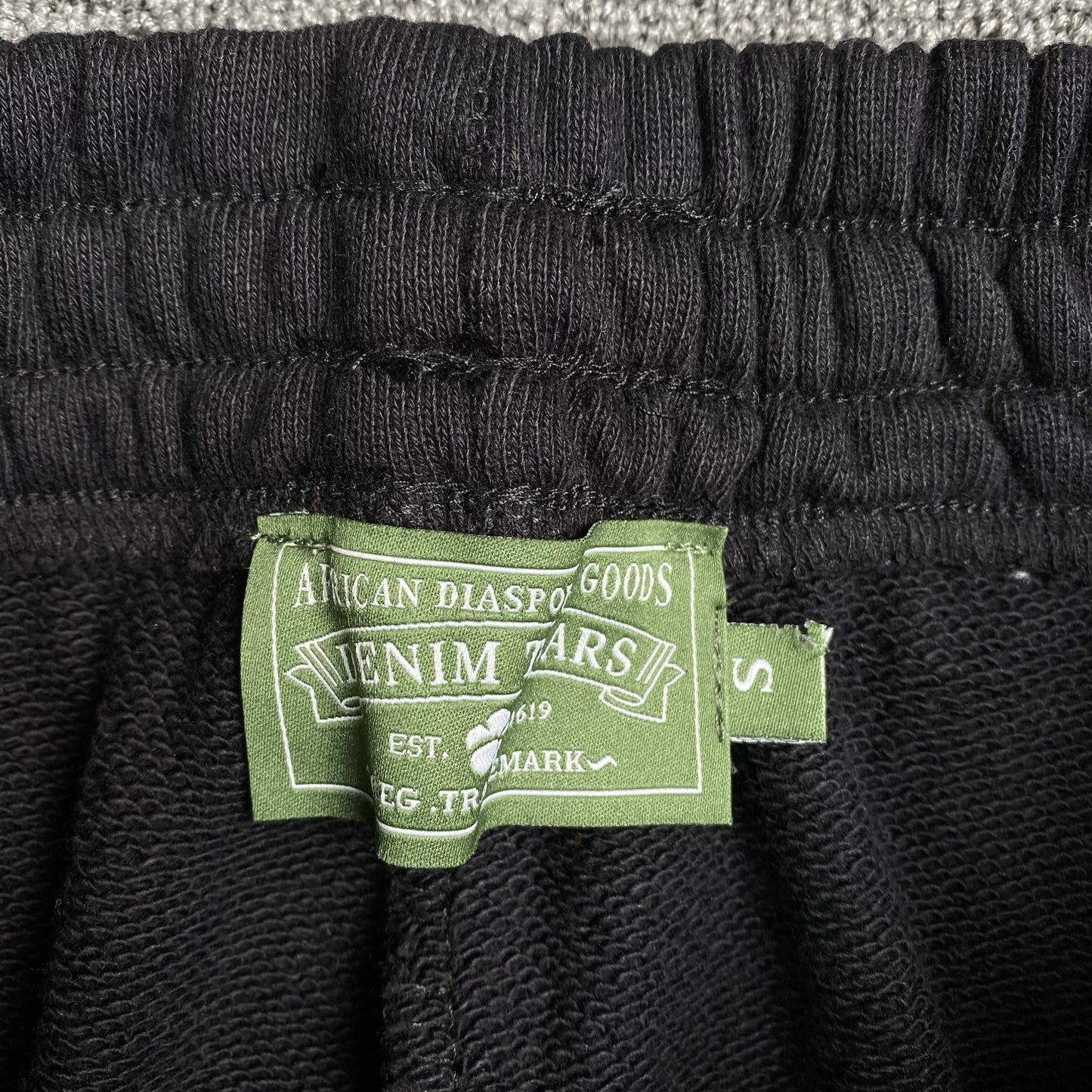DENIM TEARS THE COTTON WREATH SWEATPANTS BLACK