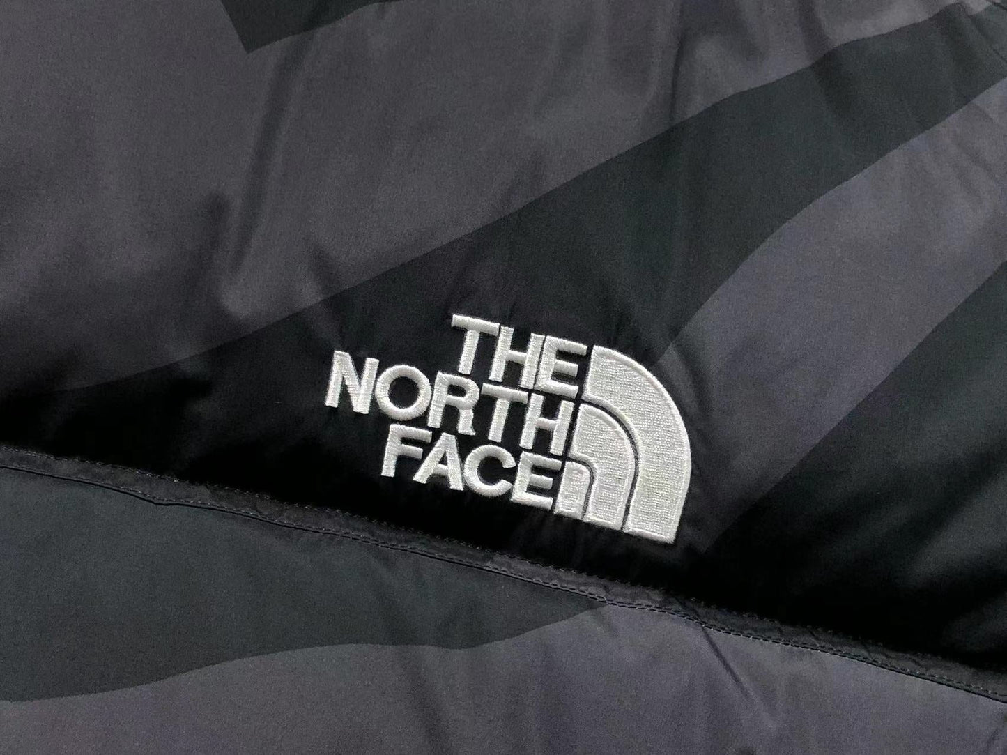 KAWS X THE NORTH FACE RETRO 1996 NUPTSE JACKET BLACK