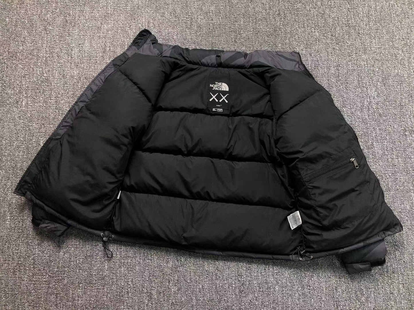 KAWS X THE NORTH FACE RETRO 1996 NUPTSE JACKET BLACK