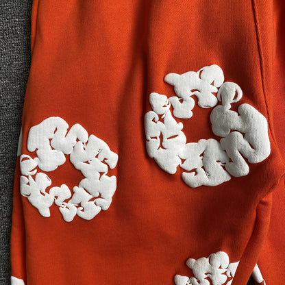 DENIM TEARS THE COTTON WREATH SWEATPANTS ORANGE
