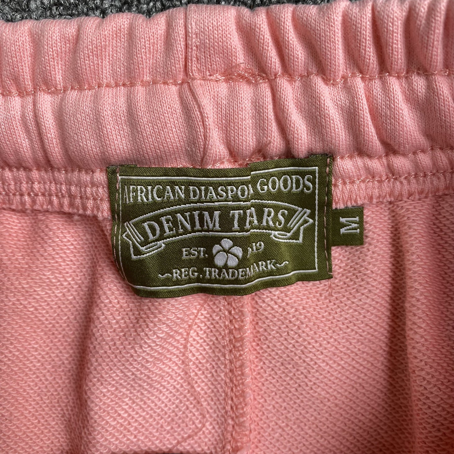DENIM TEARS THE COTTON WREATH SWEATPANTS PINK