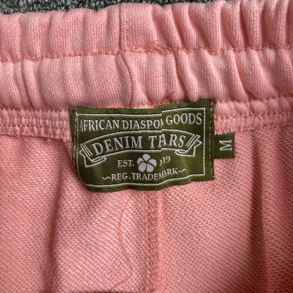 DENIM TEARS THE COTTON WREATH SWEATPANTS PINK