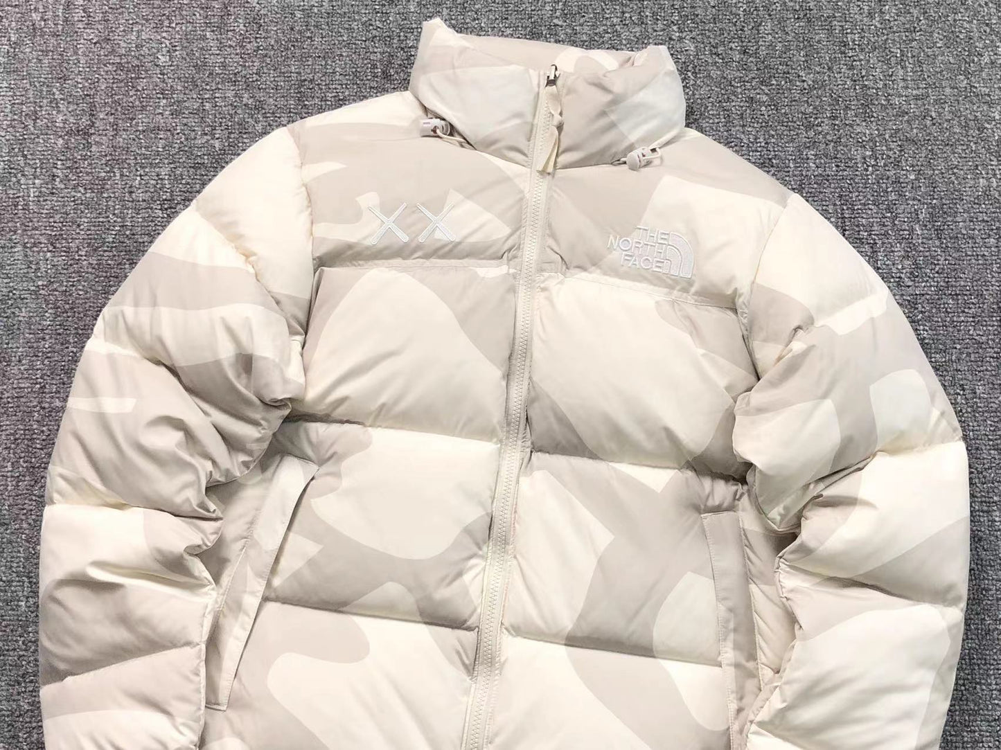 KAWS X THE NORTH FACE RETRO 1996 NUPTSE JACKET MOONLIGHT IVORY
