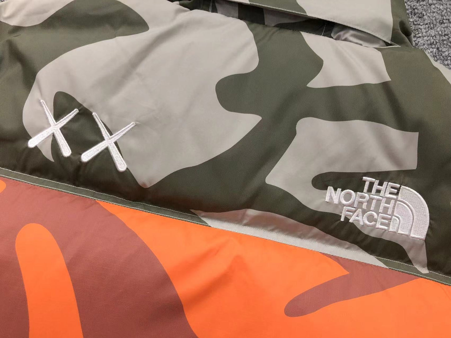 KAWS X THE NORTH FACE RETRO 1996 NUPTSE JACKET MOONLIGHT IVORY