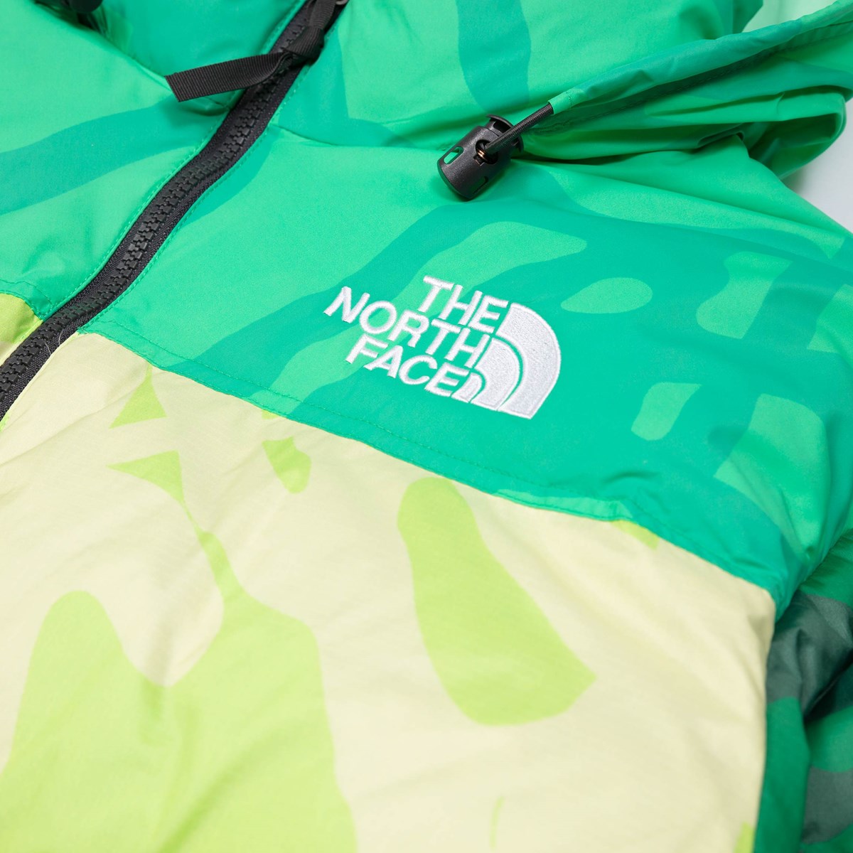 KAWS X THE NORTH FACE RETRO 1996 NUPTSE JACKET SAFETY GREEN