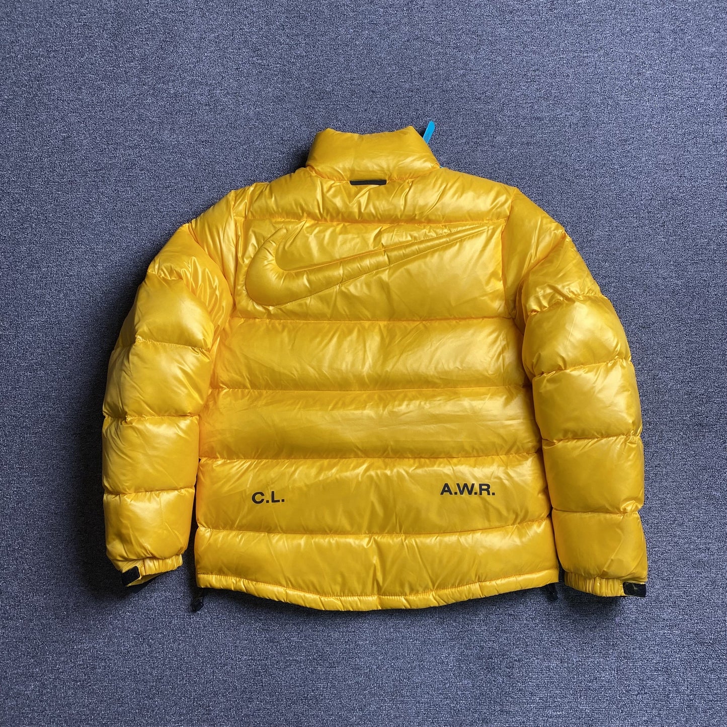 NIKE X NOCTA SUNSET PUFFER JACKET YELLOW
