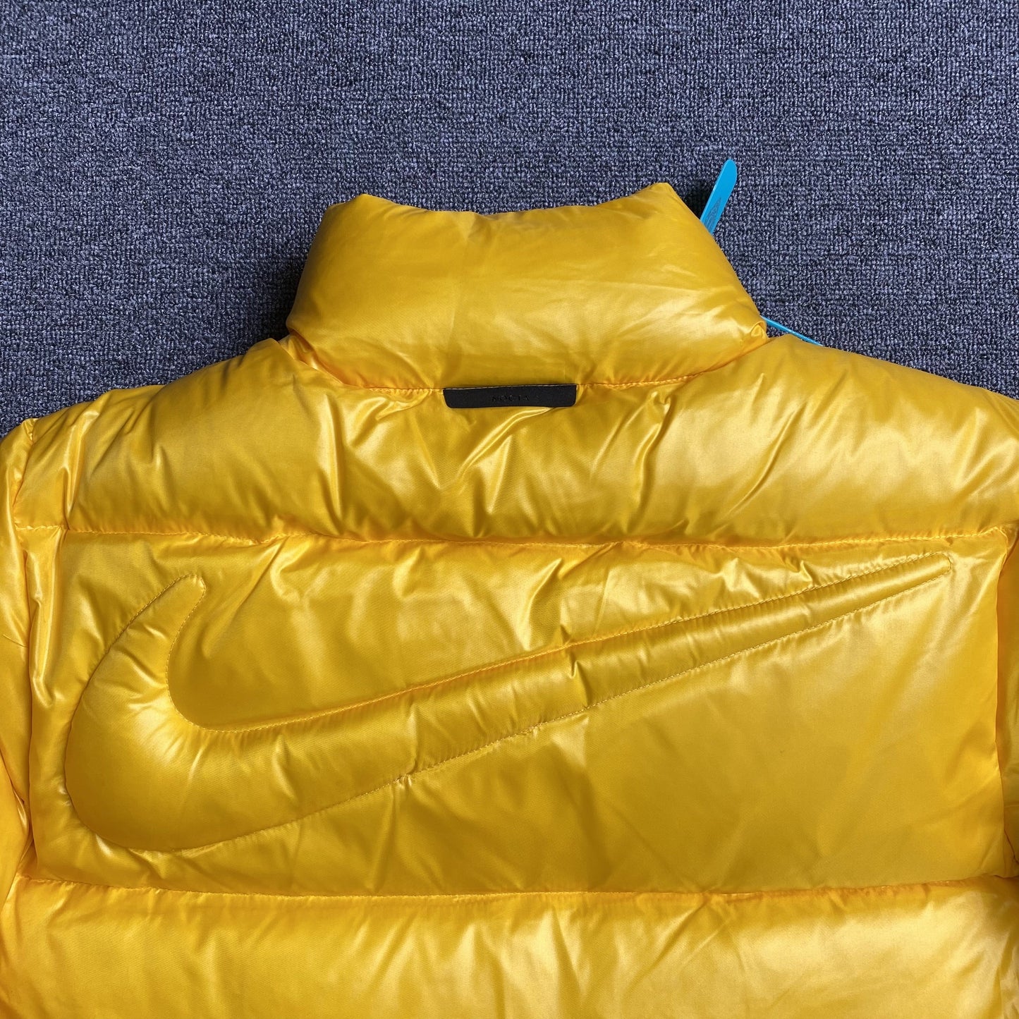 NIKE X NOCTA SUNSET PUFFER JACKET YELLOW