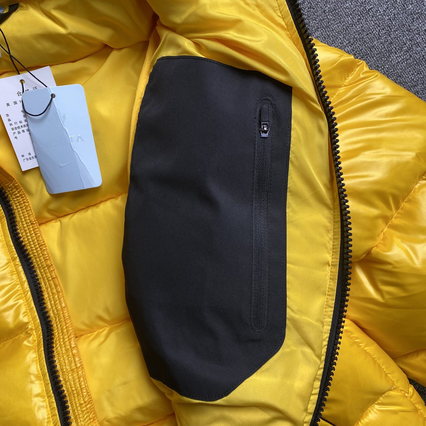NIKE X NOCTA SUNSET PUFFER JACKET YELLOW